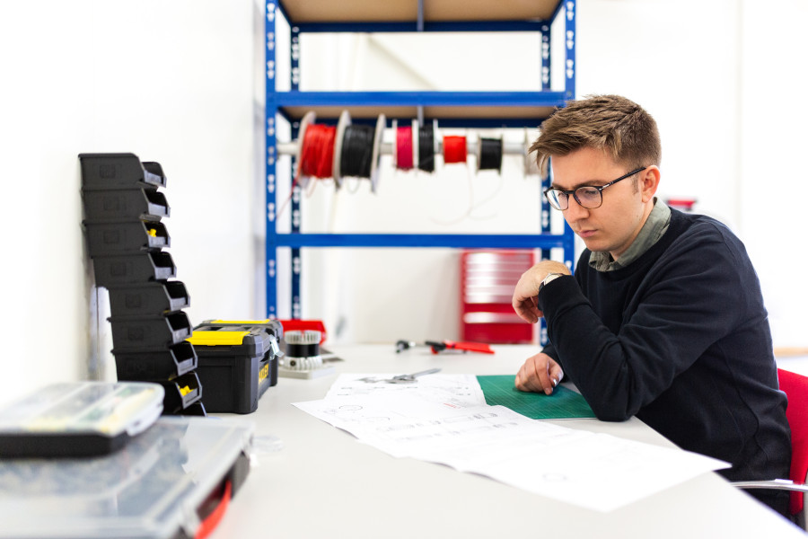 Volunteers to work in metal, wood, plastic, or electronics.